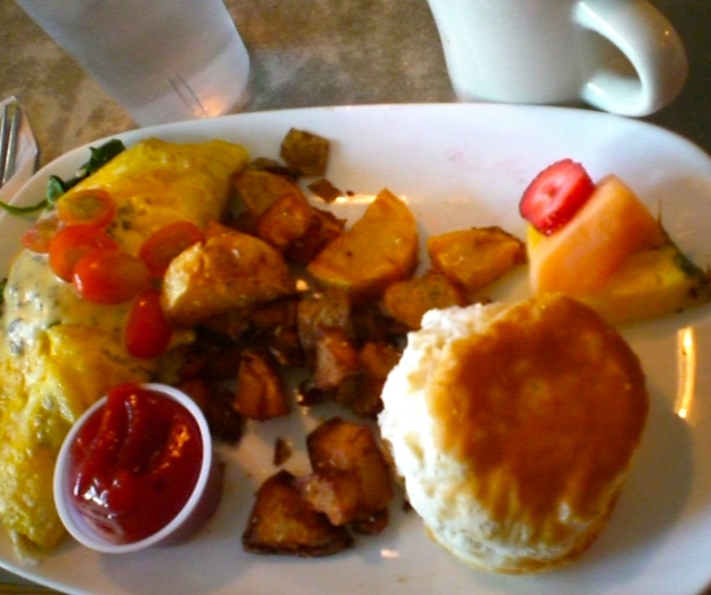 Spinach, cheese, and crab omlette with a southern biscuit and potatoes!